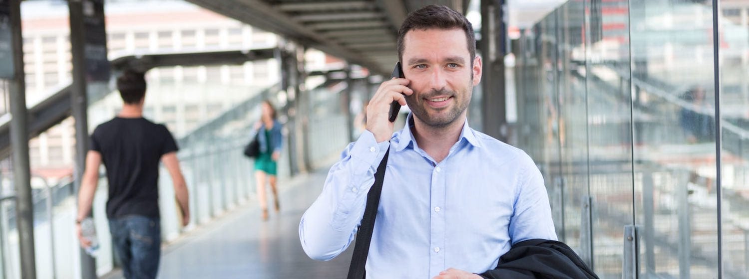 Professional Man on mobile in public space
